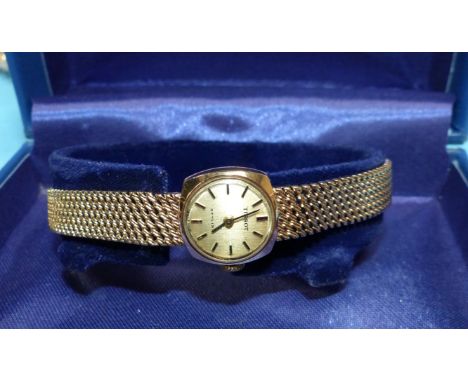 A ladies Tissot 9 carat hallmarked gold watch on 9 carat hallmarked gold woven strap, net weight 16.5