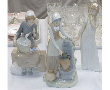 Three large Nao figures:  woman with water jar; woman with goose in basket, and girl in nightdress