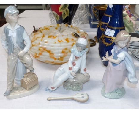 A Lladro figure of a girl; a Nao clown, and shoeshine boy