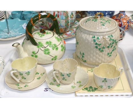 A Belleek porcelain biscuit barrel; 3 cabinet cups and 2 saucers, black back stamp; a Japanese teapot; a 1960's Belleek catal