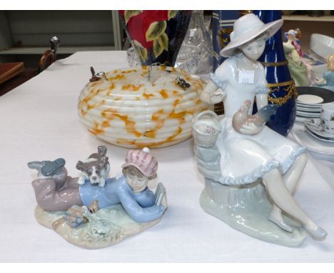 A Lladro group:  boy and dog; a Nao group: girl with hen