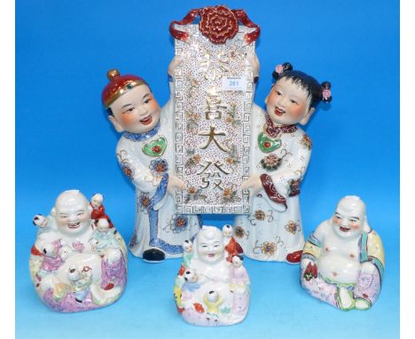A modern Chinese group with scroll; a Hotei figure