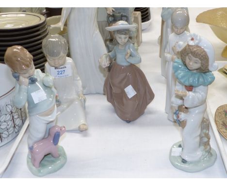 Four Nao figures of children