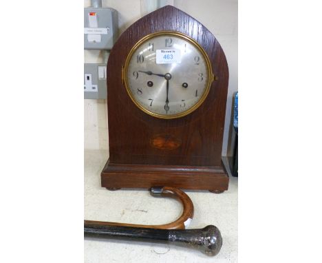 An Edwardian oak lancet top striking mantel clock; 2 silver mounted walking sticks