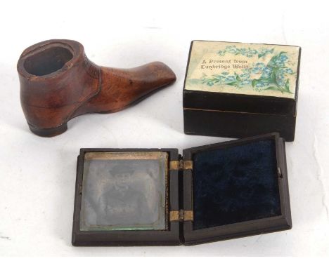 Mixed Lot: A Victorian bakelite cased daguerreotype depicting an image of a young gentleman (a/f), an antique treen shoe shap
