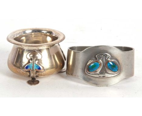 Mixed Lot: An Arts &amp; Crafts Tudric pewter and enamel napkin ring 0919 by Archibald Knox for Liberty &amp; Co, circa 1902 
