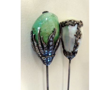 French Belle Epoque emerald and diamond hatpin mounted with a large emerald in a diamond set foliate mount, together with ano