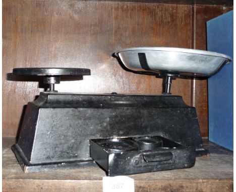 Old metal kitchen scales with weights inside integral drawer