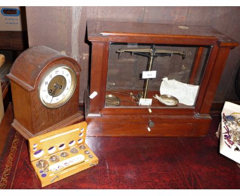 Chemist's scales in mahogany case by Becker &amp; Sons of Rotterdam with weights, together with an oak cased mantle clock (A/