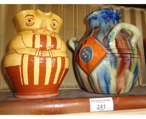 A Susan Juniper glazed terracotta character jug and a Continental Art pottery 3 handled vase