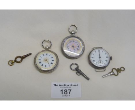 Two ladies silver pocket watches with gilded enamel dials and a ladies silver wristwatch