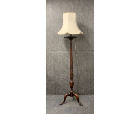 An impressive carved mahogany torcher style standard lamp, H. 198cm (with shade).