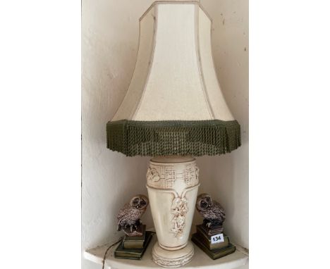 A 1920's Oriental design plaster table lamp with a pair of owl bookends.