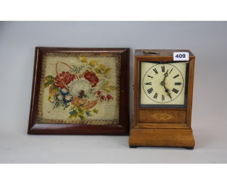 A 19th century walnut mantle clock and a tapestry kettle stand/ wall hanging.