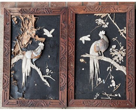 A pair of Japanese mother of pearl and carved bone decorated panels, 45 x 70cm. Together with a further pair of carved bone d