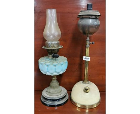 A Victorian oil lamp and Victorian kerosene lamp.