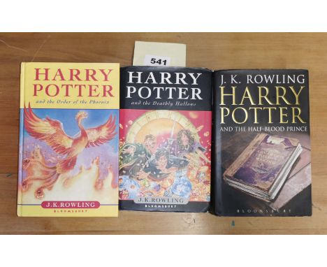 Three first edition Harry Potter books including rare misprint version of "Half blood prince" referring to 'eleven outstandin