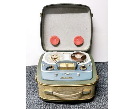 A vintage Grundig TK25 reel to reel tape recorder.