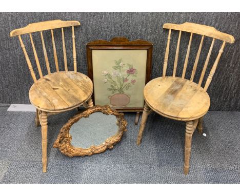 A pair of dining chairs, together with a gilt framed mirror and an embroidered fire screen.