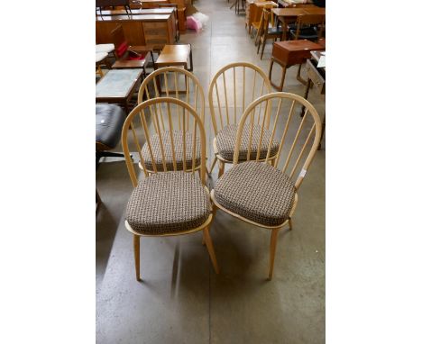 A set of four light Ercol ash Windsor dining chairs 