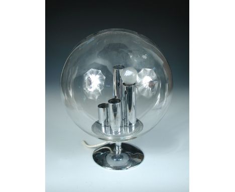 A 1970's chrome and glass table lamp in the manner of Verner Panton, the clear glass spherical shade with four tiered bulb fi