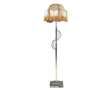An Art Deco chrome standard lamp, the square section column mounted with offset barred demi-lune designs, raised on a stepped
