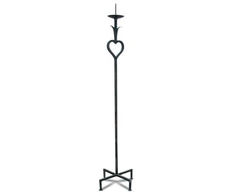 Jean Royere, (1902-1981), a wrought-iron pricket candle stick, with heart motif, raised on a cruciform base 175cm (68in)  