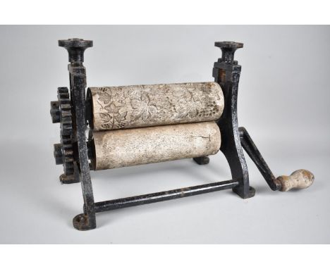 A Vintage Cast Iron Press with Wooden Rollers, One Carved with Vines and Grapes, 34cms Wide and 29cms High 