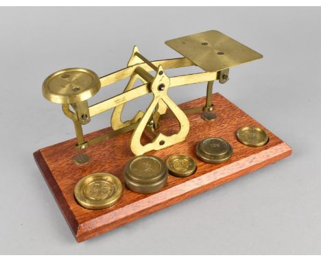 A Reproduction Brass Postage Scale with Weights, 17.5cms Wide 