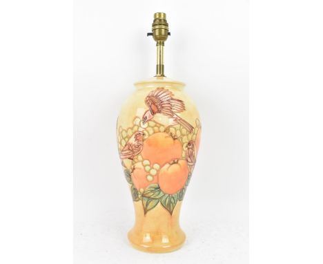 A Moorcroft pottery 'Finches Ochre' pattern table lamp, designed by Sally Tuffin, circa 1990, of baluster form, the underside