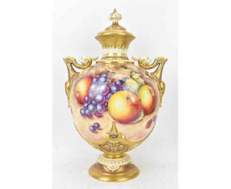 A Royal Worcester porcelain twin handled pedestal vase and cover of baluster form, shape no. 1691, painted and signed by Free