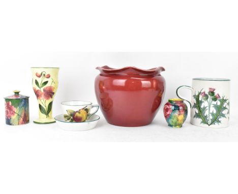 A collection of Wemyss pottery to include a sang de boeuf glazed jardiniere 17.5cm high x 22cm wide, a bud vase 17cm high x 7