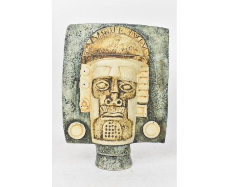 A Troika pottery Aztec Mask by Tina Doubleday, both sides moulded in high relief with stylised faces, one with head dress, in