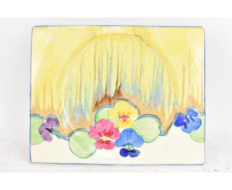 An Art Deco Clarice Cliff Bizarre 'Delecia Pansies' pattern biarritz plate, circa 1930s, hand painted and of rectangular form