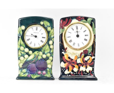 Two Moorcroft pottery mantle clocks to include 'Finches and Fruit' pattern clock on a green ground, designed by Sally Tuffin,