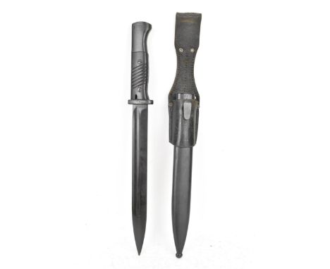 A German Third Reich era K98 Mauser bayonet, the blade marked S/173K and 1509, with steel scabbard and leather frog, bayonet 