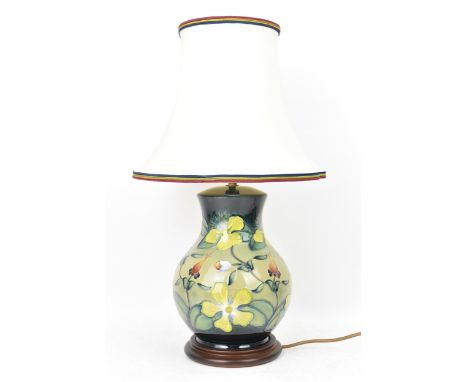 A Moorcroft pottery 'Hypericum' pattern table lamp, designed by Rachel Bishop, of baluster form and decorated with yellow flo