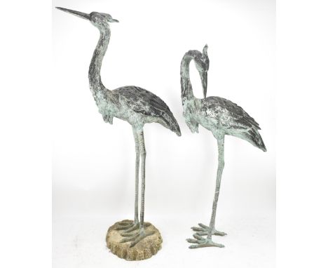 Two 20th century large light green patinated cast bronze models of cranes, one mounted on a naturalistic rocky base, 105.5cm 