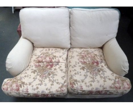 A cream two seater sofa