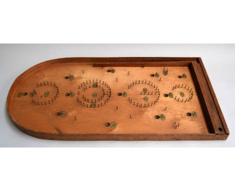 A Bagatelle board and two wooden trays