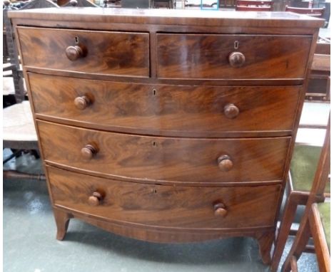 A bow fronted chest of drawers, two short over three long