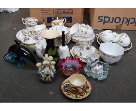 A box of vintage tea wares and a Poole Pottery Dolphin