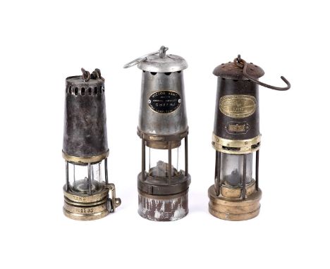 Three miners’ lamps: a Deflector type lamp, stamped ‘1382’ and ‘1593’, 25cms; a Wolf Safety Lamp, stamped ‘Victor Kent Wolf-L