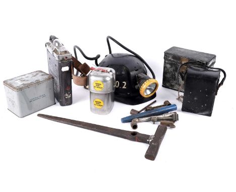 A collection of mining related items, to include: helmet with electric lamp and pit check; a boxed ‘DustFoe’ respirator; a de