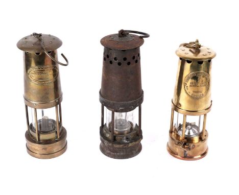Three miners' lamps, to include: a Davis Kirkby 'Haydock' pattern miners’ lamp, 27cms; an Eccles type 6 Protectors lamp, 25cm