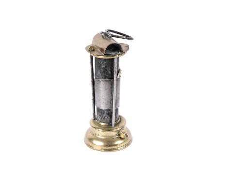 An 19th Century brass Davy miners' lamp by Laidler, Durham, with hinged hood, iron gauze and screw off base, height 21cms.