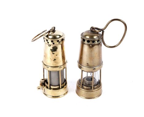 Two brass bonneted ‘Clanny’ lamps, to include a Davis bonneted Clanny Officials lamp, with stokes shut off and mirrored glass