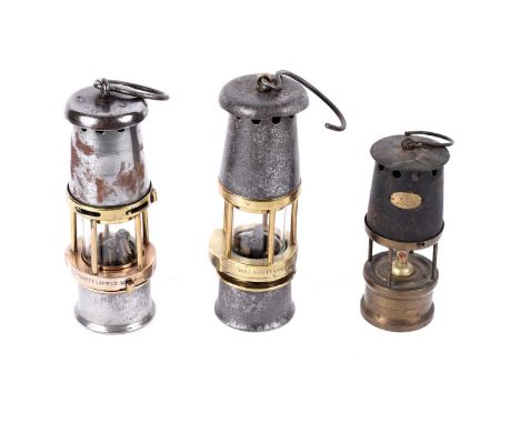 Three miners' lamps, to include: two Baby Wolf Lamps by the Wolf Safety Lamp Co., W.M. Maurice Ltd Sheffield; and another sma