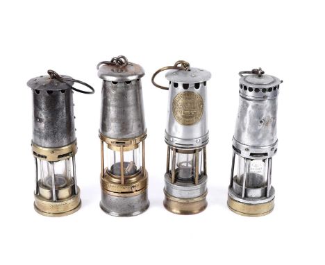 Four miners’ lamps, to include: an Ackroyd and Bests Ltd Improved; a Wolf Safety Lamp No. 7 RMBS; an aluminium and brass lamp