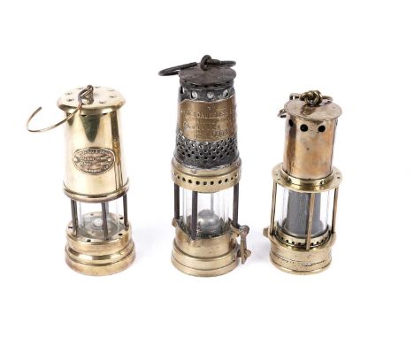 Three miners’ lamps, to include: one by Best’s Gauzeless Lamp Co Ltd, Fleece Lane Leeds, 27cms; one by Ferndale Coal and Mini